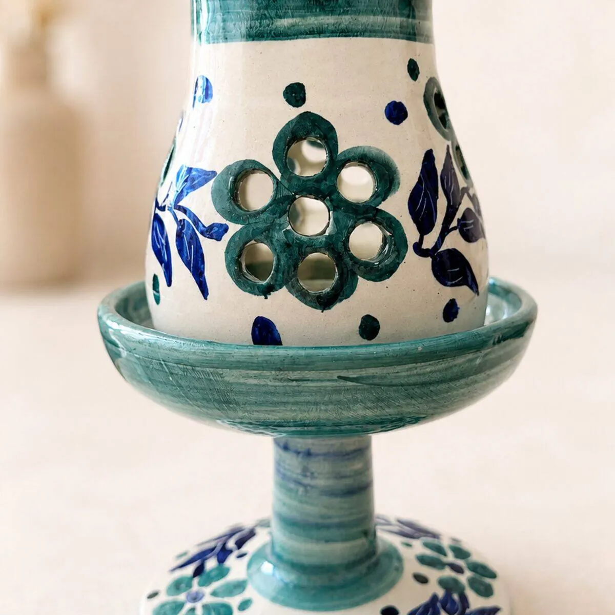 Teal and cobalt hand-painted ceramic candle holder with pierced flower cutouts by Dizayn74