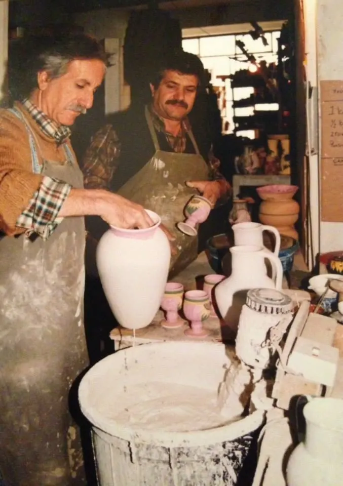 Hasan and Tomrul glazing freshly thrown vases and goblets in the Dizayn74 workshop